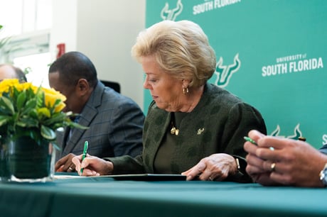 President Law at signing ceremony.