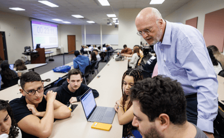 Faculty member working with students