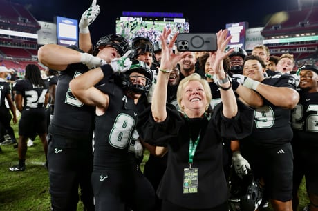 President Law and Bulls football team