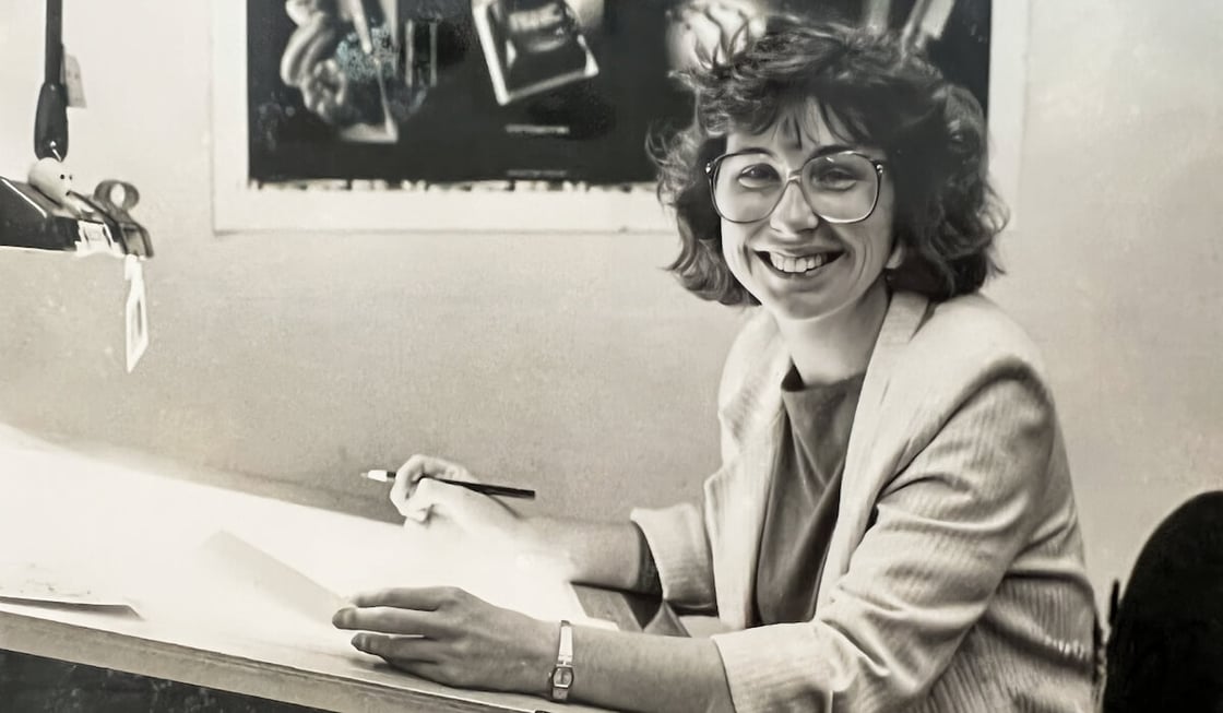 Anne Scott works at a drafting table.