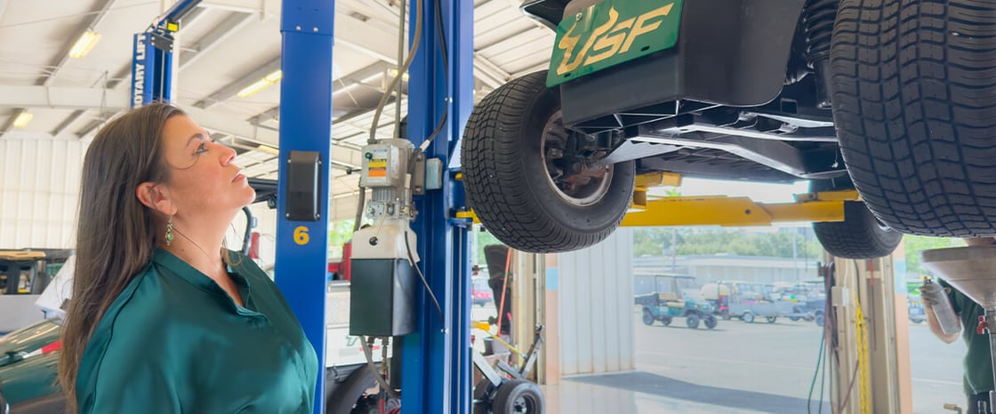 Araya inspects a recently returned golf cart.