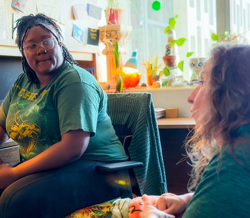 Counselors meet between sessions.