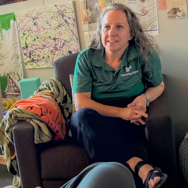 A counselor confers with a colleague.