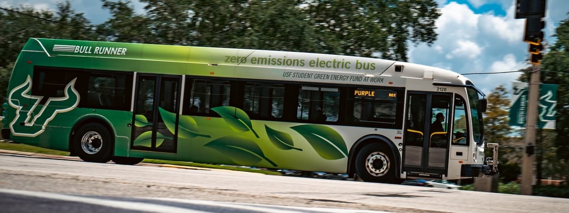A zero emissions electric bus transports USF students.