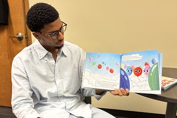 Jayden Haggler with the book he co-authored
